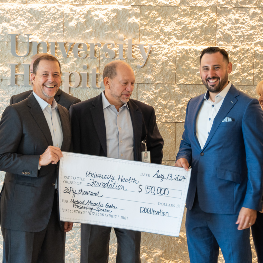 Robby brown bringing DOCUmation check to University Health. 
